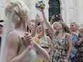 Thumbnail Bride tosses the bouquet in front of Sponza Palace, Dubrovnik